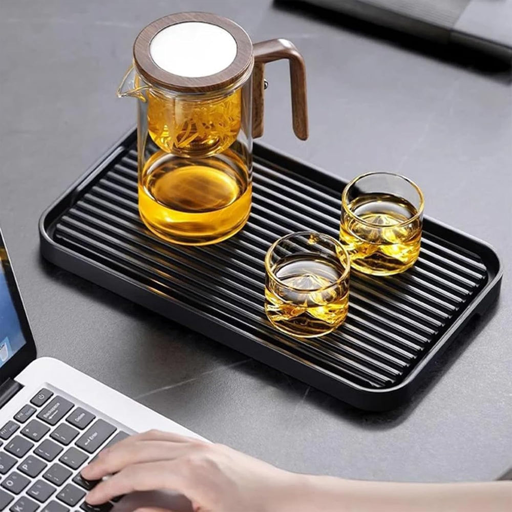 Borosilicate glass tea set with press filter, including teapot and 4 cups for elegant tea brewing