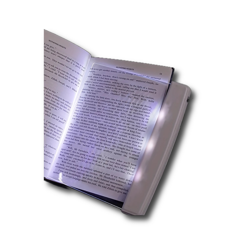 Flat panel LED book reading light providing page illumination
