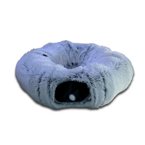 Soft gray collapsible cat tunnel bed with plush donut design and hanging pom-pom toy, providing a cozy hideaway and play space for cats