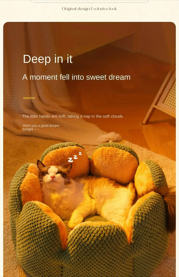 Sleepy cat lying in a green flower-shaped plush pet bed in a warm, softly lit room with decorative text about comfort and dreaming.