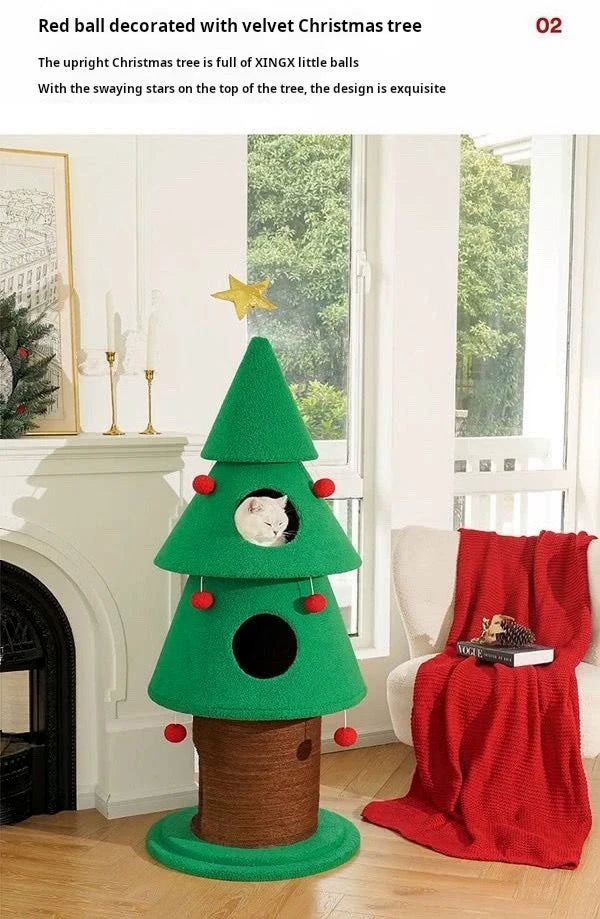 Green Christmas tree-shaped cat bed with red balls in a living room setting.