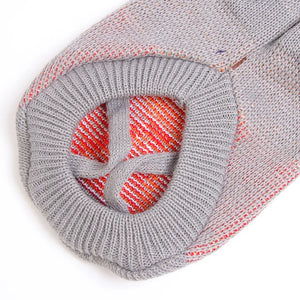 Festive dog sweater gray - close-up showing decorative pattern with red accents
