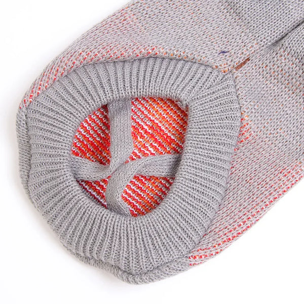 Festive dog sweater gray - close-up showing decorative pattern with red accents
