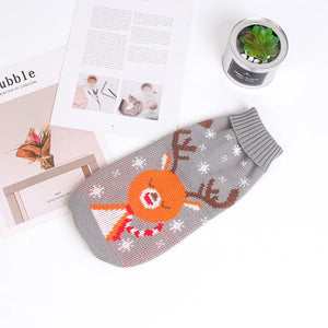 Festive knitted dog sweater with reindeer pattern - gray flat lay lifestyle shot

