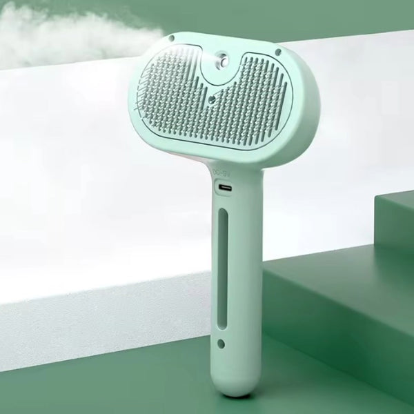 Spazzola nebulizzante PurrEmbassy verde con denti in acciaio inox