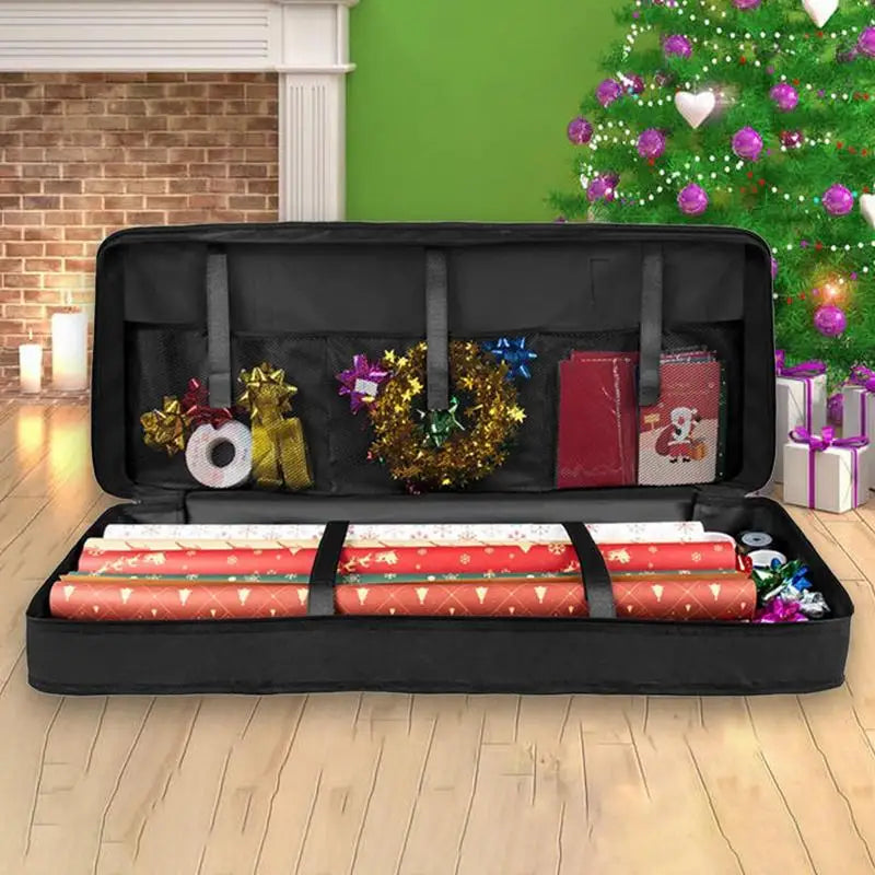 Black storage case with wrapping paper, ribbons, and decorative items on a white background