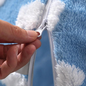 Close‑up of zipper on blue cloud pattern donut cat tunnel bed, removable washable cover for easy cleaning.