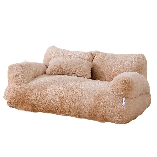 Beige plush cat bed sofa with backrest and side pillows, soft and supportive winter nest for cats and small dogs.
