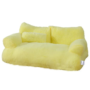 Yellow plush cat bed sofa with backrest and side pillows, soft and cozy pet nest for cats and small dogs.