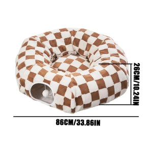 Brown and white checkerboard donut cat tunnel bed with hanging toy ball, showing size 86 cm by 26 cm for indoor cats and small pets
