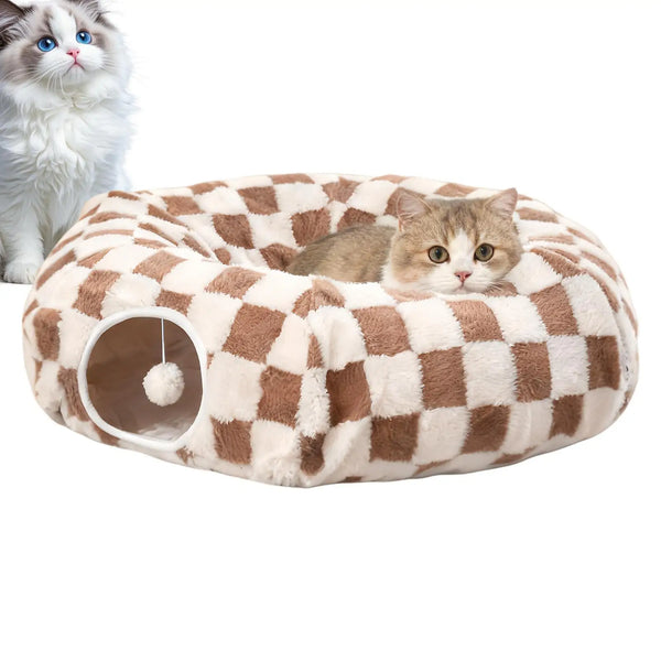Two cats with a brown and white checkerboard donut cat tunnel cave bed with hanging toy ball, cozy velvet indoor cat bed for play and naps.