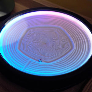 ound LED zen sand lamp with blue and purple gradient light and concentric hexagon sand pattern on a black base